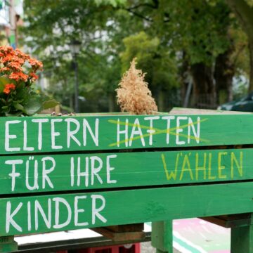 a wooden sign with words written on it