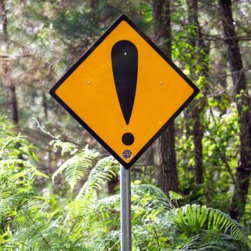 yellow and black road sign