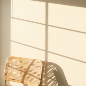 a chair sitting next to a window in a room