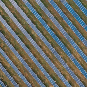 Textured background of solar panels in countryside field