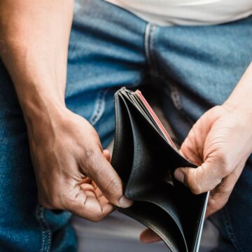 A Person Holding a Wallet