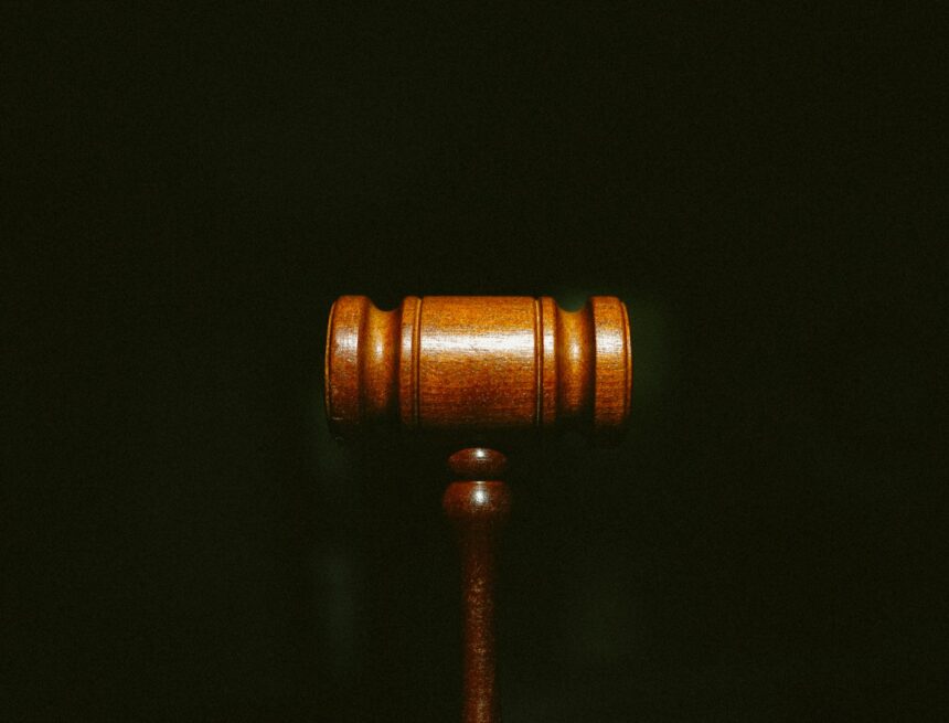 Photo by Tingey Injury Law Firm brown wooden stand with black background