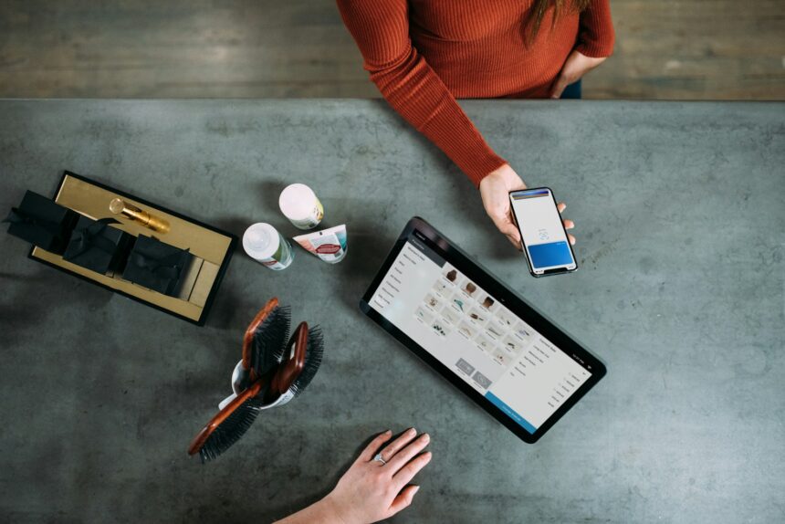 Photo by Blake Wisz person holding smartphone beside tablet computer